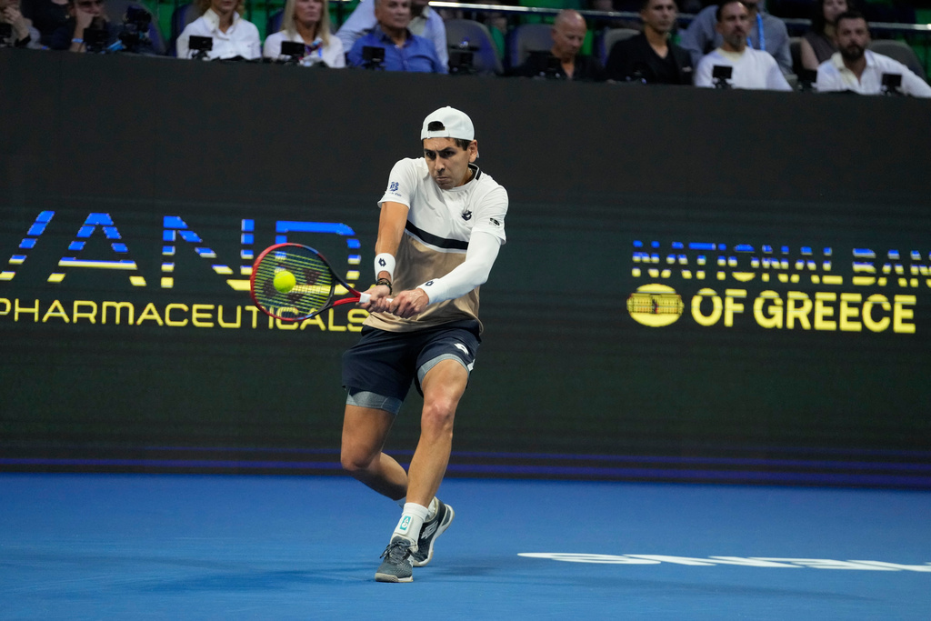 Alejandro Tabilo of Chile plays a shot against Novak Djokovic of Serbia during the ATP tournament round of 16 tennis match, in Athens, Greece, Tuesday, Nov. 4, 2025. (AP Photo/Petros Giannakouris)