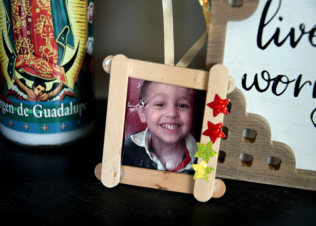 A childhood photo of Max Osterman, whose mother says he died after taking fentanyl he bought from a dealer on Snapchat, is displayed in his mother's living room in Thornton, Colo., on Thursday, March 26, 2026. (AP Photo/Thomas Peipert)