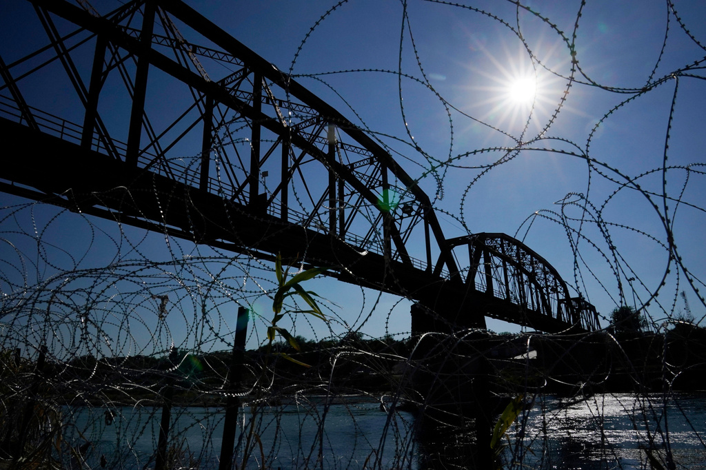 FILE - The Union Pacific International Railroad Bridge is seen behind concertina wire, Sept. 22, 2023, in Eagle Pass, Texas. (AP Photo/Eric Gay, File)