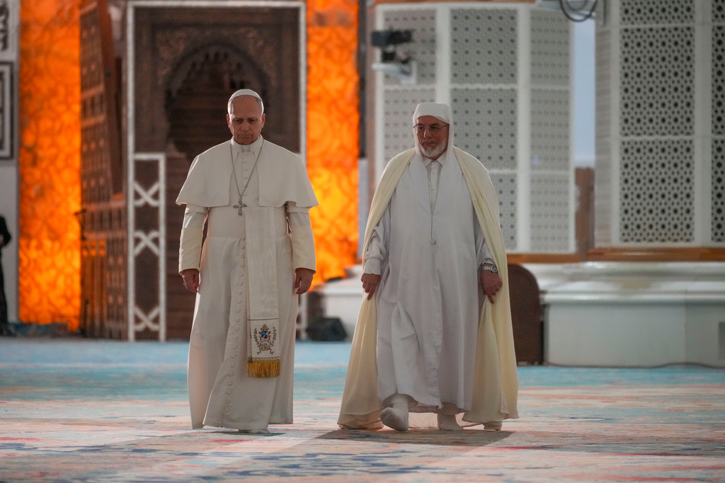 Pope Leo XIV is welcomed by Rector Mohamed Mamoun Al Qasimi upon his arrival at the Great Mosque in Algiers, Monday, April 13, 2026, on the first day of an 11-day apostolic journey to Africa. (AP Photo/Andrew Medichini)