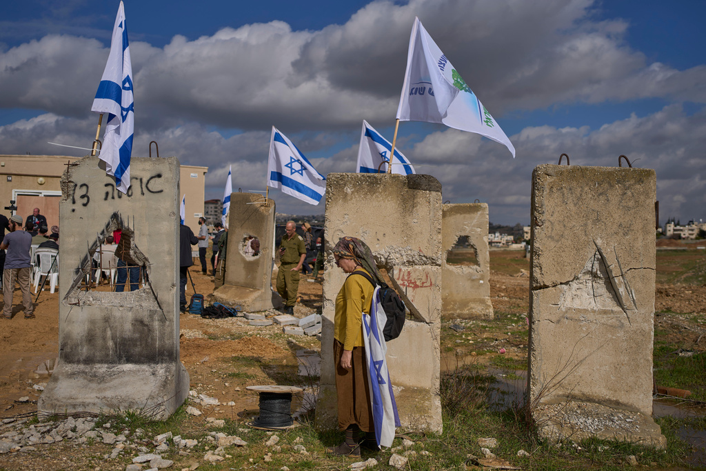 Settlers attend an inauguration ceremony for a newly-legalized Jewish settlement, Yatziv, adjacent to the Palestinian town of Beit Sahour, in the West Bank, Jan. 19, 2026. (AP Photo/Ohad Zwigenberg)