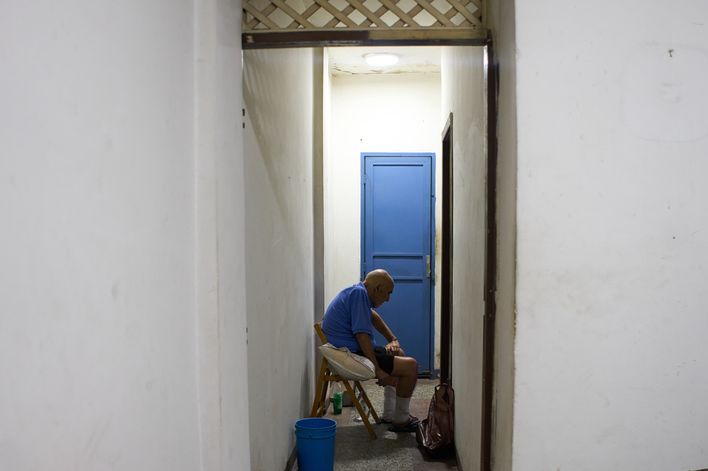 Jose Breijo, a dual citizen of Uruguay and Venezuela, sits in his apartment in Caracas, Venezuela, Wednesday, May 27, 2026, after being released following two years in prison on terrorism charges. (AP Photo/Ariana Cubillos)