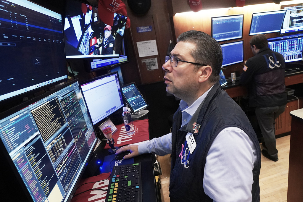 Trader Michael Capolino works on the floor of the New York Stock Exchange, Monday, Nov. 24, 2025. (AP Photo/Richard Drew)