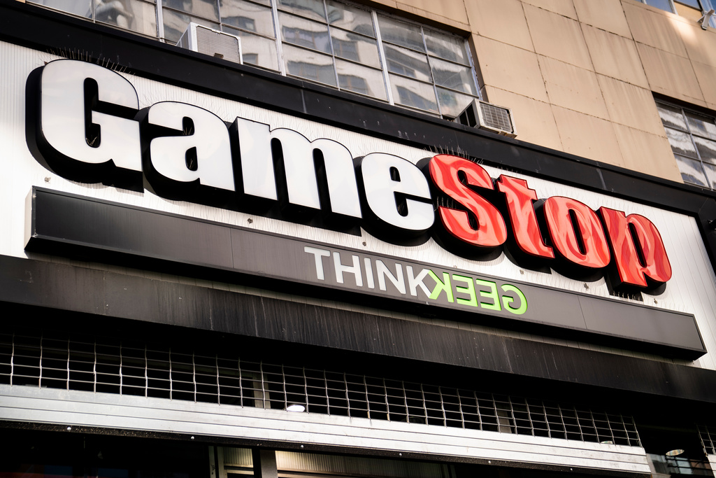 FILE - Pedestrians pass a GameStop store on 14th Street at Union Square, Thursday, Jan. 28, 2021, in the Manhattan borough of New York. (AP Photo/John Minchillo, File)