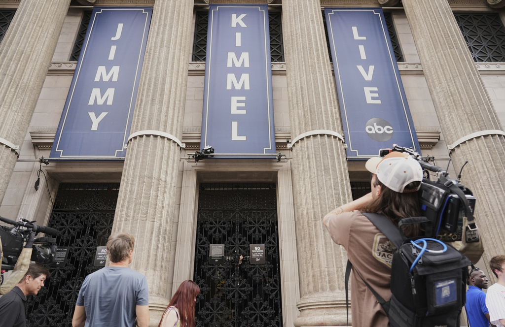 Media gather in front of the Jimmy Kimmel Live studio on Hollywood Blvd., Wednesday, Sept. 17, 2025, in Los Angeles. (AP Photo/Chris Pizzello)