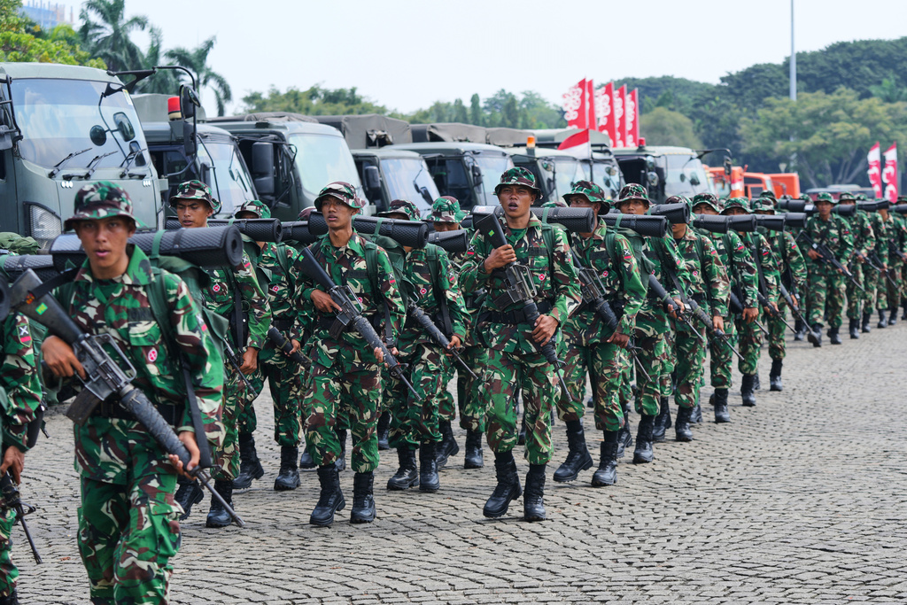 FILE - Army soldiers are deployed following violent protests against lawmakers' perks and privileges, in Jakarta, Indonesia, Sept. 1, 2025. (AP Photo/Tatan Syuflana, File)