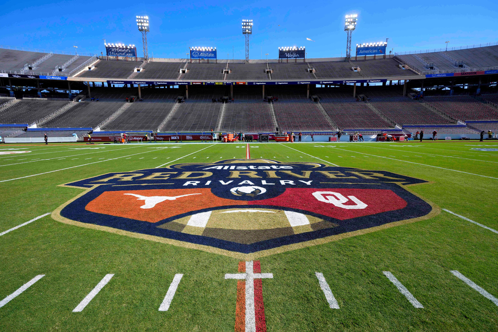 The logo of the Allstate Red River Rivalry is painted at midfield of the Cotton Bowl before an NCAA college football game between Texas and Oklahoma, Saturday, Oct. 11, 2025, in Dallas. (AP Photo/Jeffrey McWhorter)