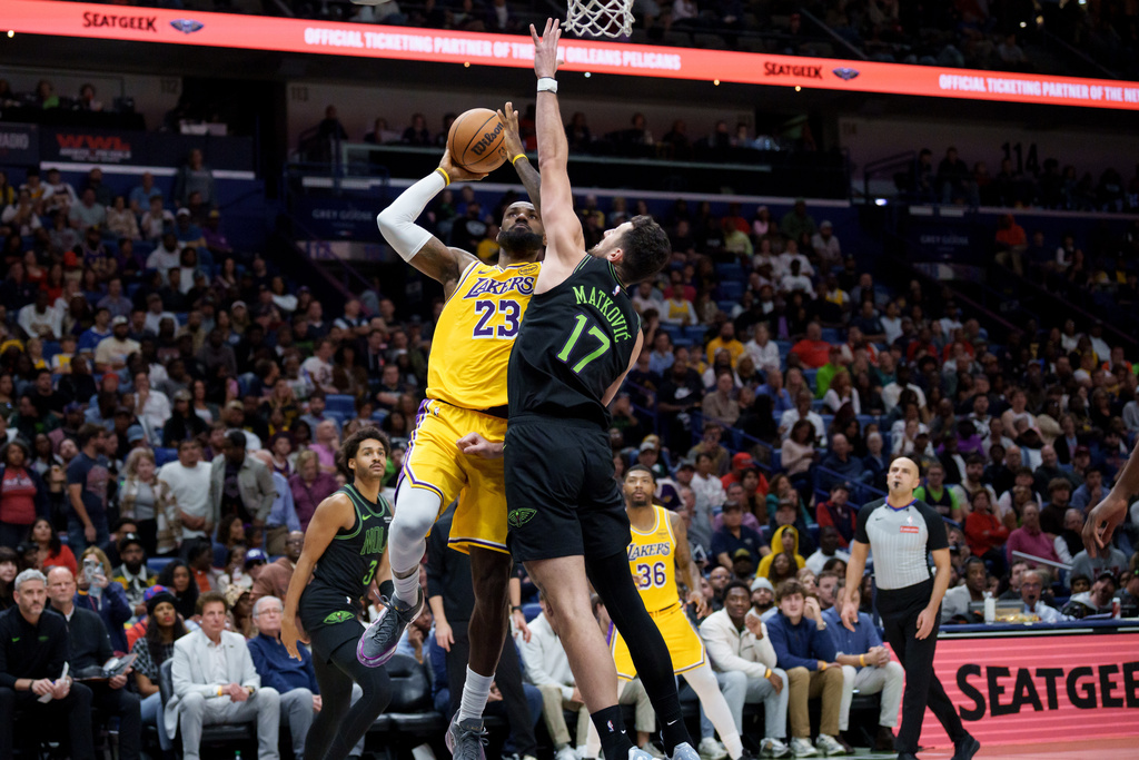 Los Angeles Lakers forward LeBron James (23) shoots against New Orleans Pelicans forward Karlo Matkovic (17) during the second half of an NBA basketball game in New Orleans, Tuesday, Jan. 6, 2026. (AP Photo/Matthew Hinton)