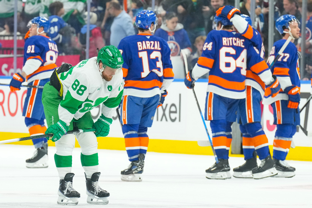 Toronto Maple Leafs' William Nylander (88) reacts at the final buzzer as New York Islanders celebrate their win during an NHL hockey game in Toronto, Tuesday March 17, 2026. (Chris Young/The Canadian Press via AP)