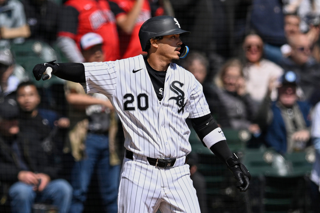 Chicago White Sox's Miguel Vargas (20) celebrates at third base after hitting an RBI triple during the first inning of a baseball game against the Toronto Blue Jays in Chicago, Sunday, April 5, 2026. (AP Photo/Paul Beaty)