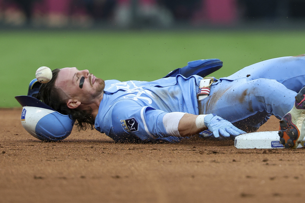 Kansas City Royals shortstop Bobby Witt Jr. steals second base during the first inning of a baseball game against the Detroit Tigers, Saturday, Aug. 30, 2025, in Kansas City, Mo. (AP Photo/David Smith)