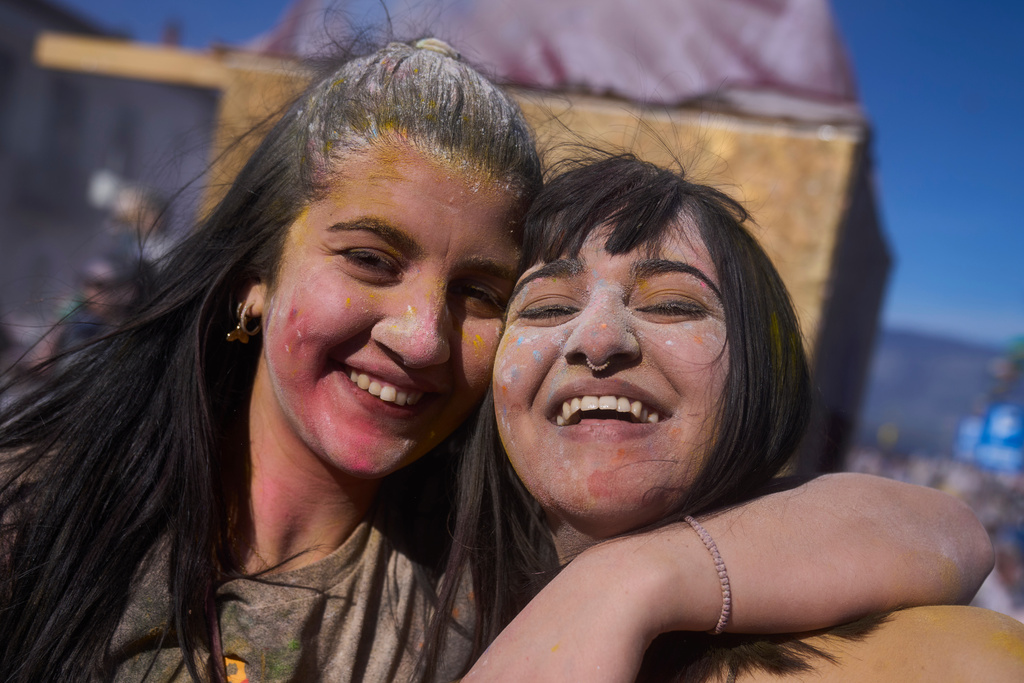Revelers take part in the annual flour war marking the end of the Carnival season on Clean Monday in Galaxidi, about 200 kilometers (120 miles) west of Athens, Feb. 23, 2026, starting the 40-day Christian Lent fast leading to Easter. (AP Photo/Petros Giannakouris)