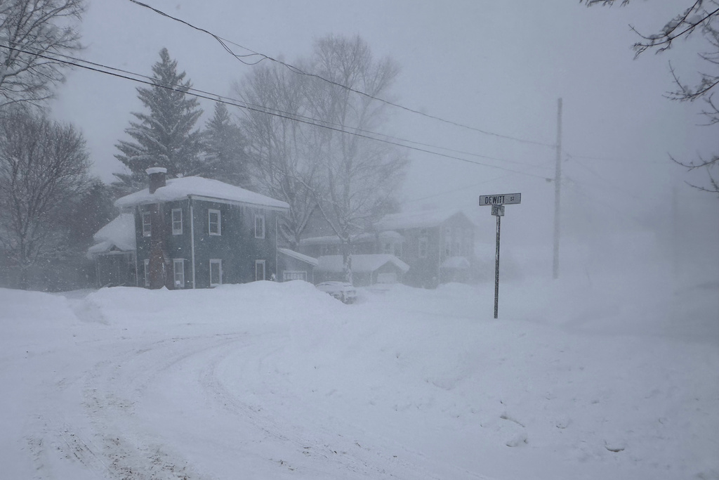 Strong winds kick up snow in Lowville, New York, on Friday, Jan. 23, 2026. (AP Photo/Cara Anna)