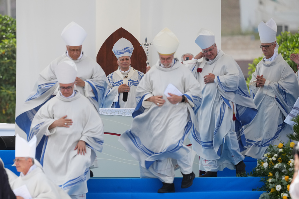 Pope Leo XIV celebrates Mass in Lampedusa, Sicily, southern Italy, Saturday, July 4, 2026, during a one-day pastoral visit to the Sicilian island that has come to symbolize the dramatic odyssey of migrants trying to reach Europe by sea. (AP Photo/Alessandra Tarantino)