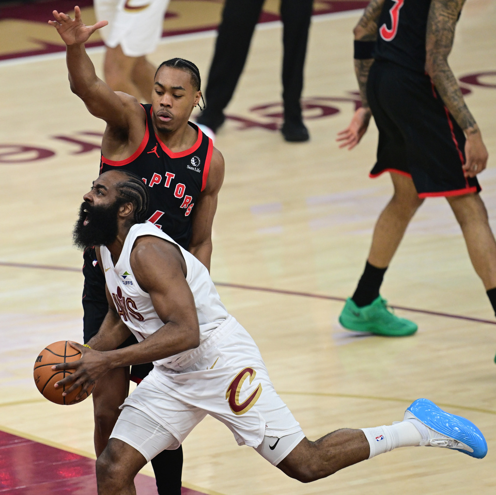 Cleveland Cavaliers guard James Harden goes to the basket against Toronto Raptors forward Scottie Barnes during the first half in Game 5 of a first-round NBA playoffs basketball series, Wednesday, April 29, 2026, In Cleveland. (AP Photo/David Dermer)