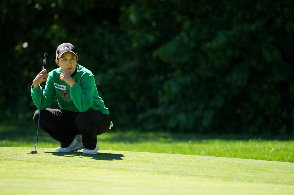 Chella Choi looks over the sixth green during the first round of the Queen City Championship LPGA golf tournament at Maketewah Country Club, Thursday, May 14, 2026, in Cincinnati. (AP Photo/Jeff Dean)