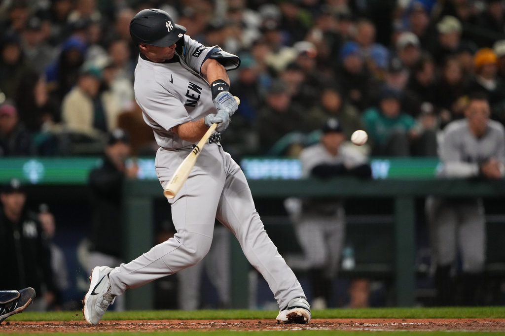 New York Yankees' Paul Goldschmidt hits a three-run home run against the Seattle Mariners during the sixth inning of a baseball game, Wednesday, April 1, 2026, in Seattle. (AP Photo/Lindsey Wasson)