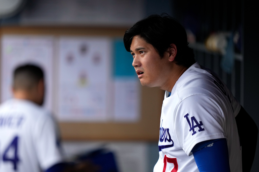 Los Angeles Dodgers' Shohei Ohtani watches from the dugout during the first inning of a baseball game against the Cincinnati Reds, Monday, Sept. 7, 2026, in Los Angeles. (AP Photo/Mark J. Terrill)