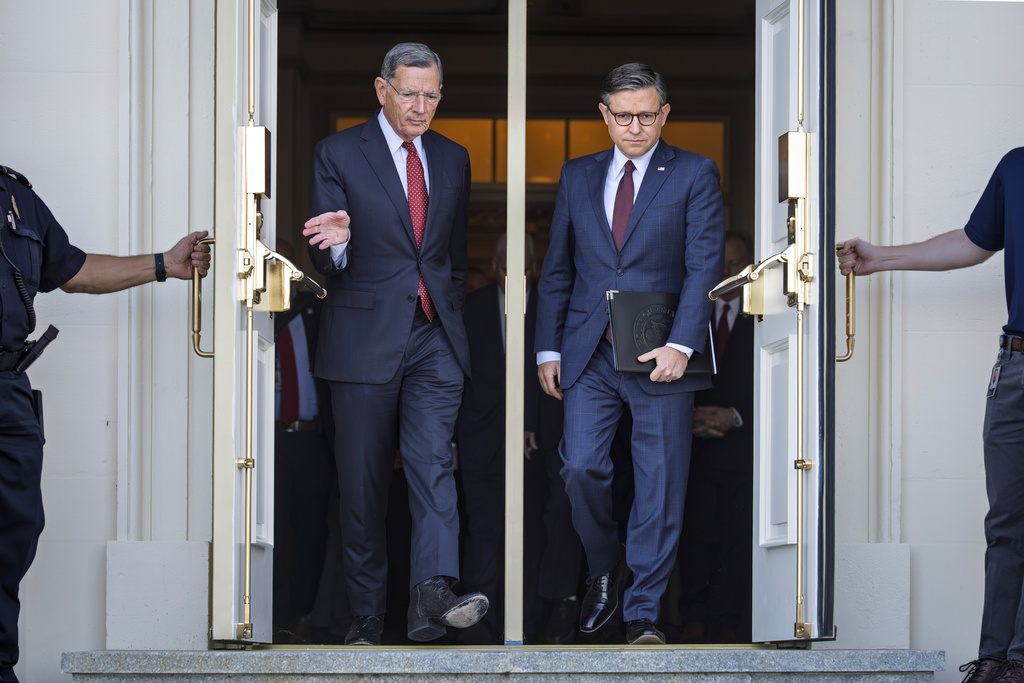 Sen. John Barrasso, R-Wyo., the Senate GOP whip, left, and Speaker of the House Mike Johnson, R-La., right, arrive for a news conference with top Republicans on the government shutdown, at the Capitol in Washington, Wednesday, Oct. 1, 2025. (AP Photo/J. Scott Applewhite)
