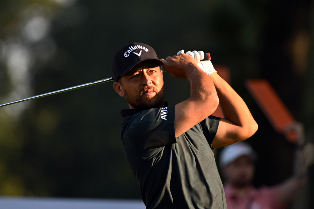 Xander Schauffele hits from the 11th tee during the first round of the Rocket Classic golf tournament at the Detroit Golf Club, Thursday, July 30, 2026, in Detroit. (AP Photo/Jose Juarez)