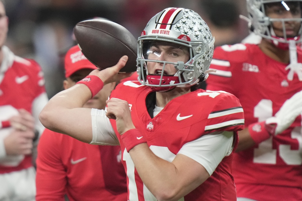 Ohio State quarterback Julian Sayin warms up before the Big Ten championship NCAA college football game against Indiana in Indianapolis, Saturday, Dec. 6, 2025. (AP Photo/AJ Mast)
