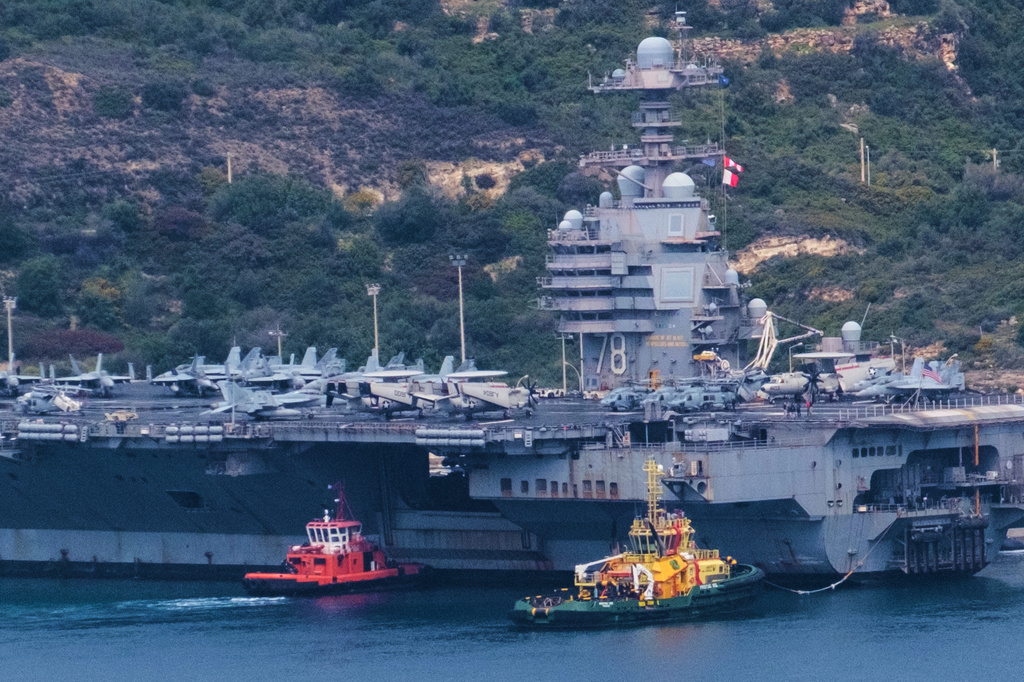 FILE - The USS Gerald R. Ford aircraft carrier is docked at Souda Naval Base near Chania on the island of Crete, Monday, March 23, 2026. (AP Photo/Giannis Angelakis).
