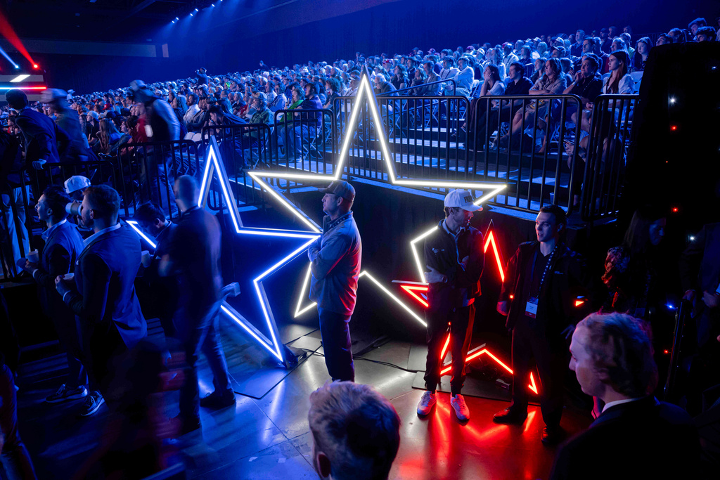 Attendees line up for the VIP section during Turning Point USA's AmericaFest 2025, Thursday, Dec. 18, 2025, in Phoenix. (AP Photo/Jon Cherry)
