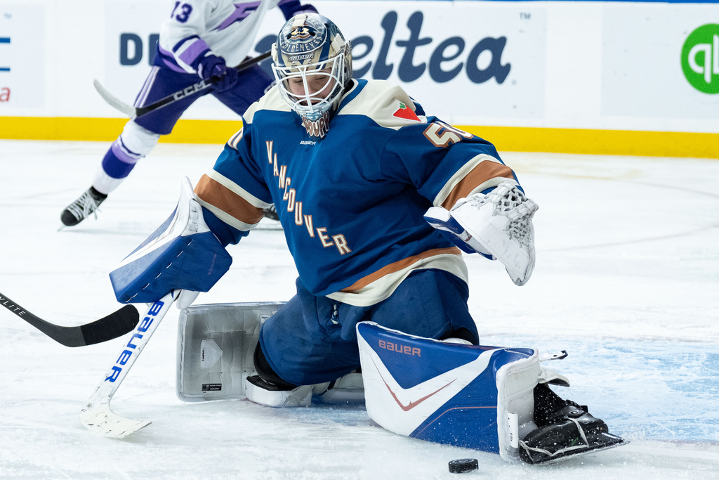 Vancouver Goldeneyes goaltender Kristen Campbell (50) makes a save against the Minnesota Frost during the second period of a PWHL hockey game in Vancouver, British Columbia, Saturday, March 21, 2026. (Ethan Cairns/The Canadian Press via AP)