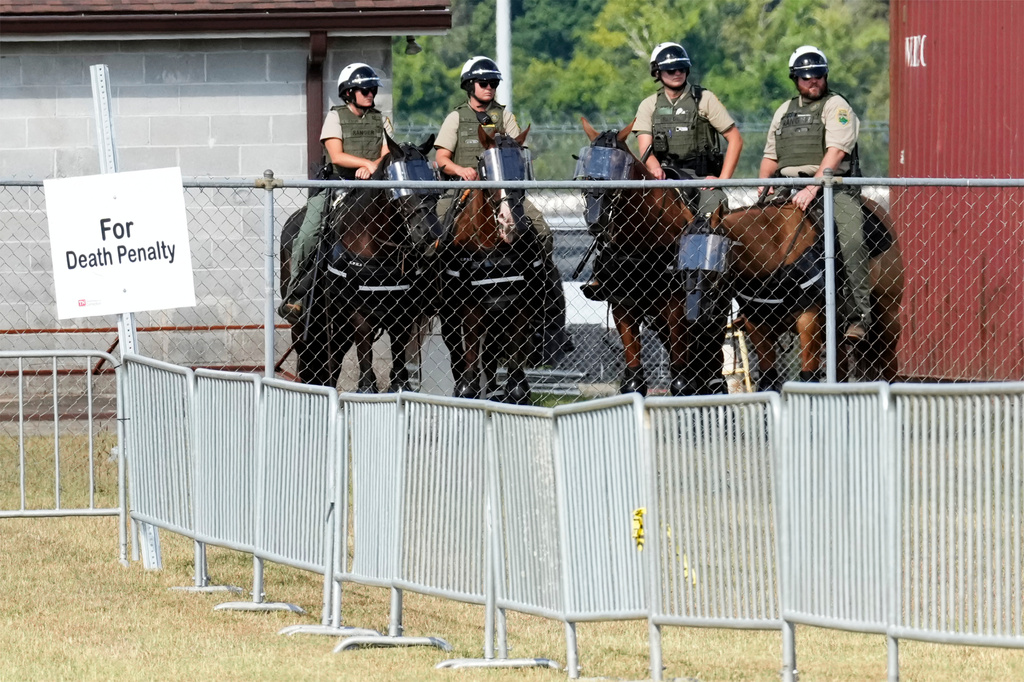 FILE - Guards watch the areas reserved for demonstrators outside Riverbend Maximum Security Institution before the execution of Byron Black, Aug. 5, 2025, in Nashville, Tenn. (AP Photo/Mark Humphrey, File)