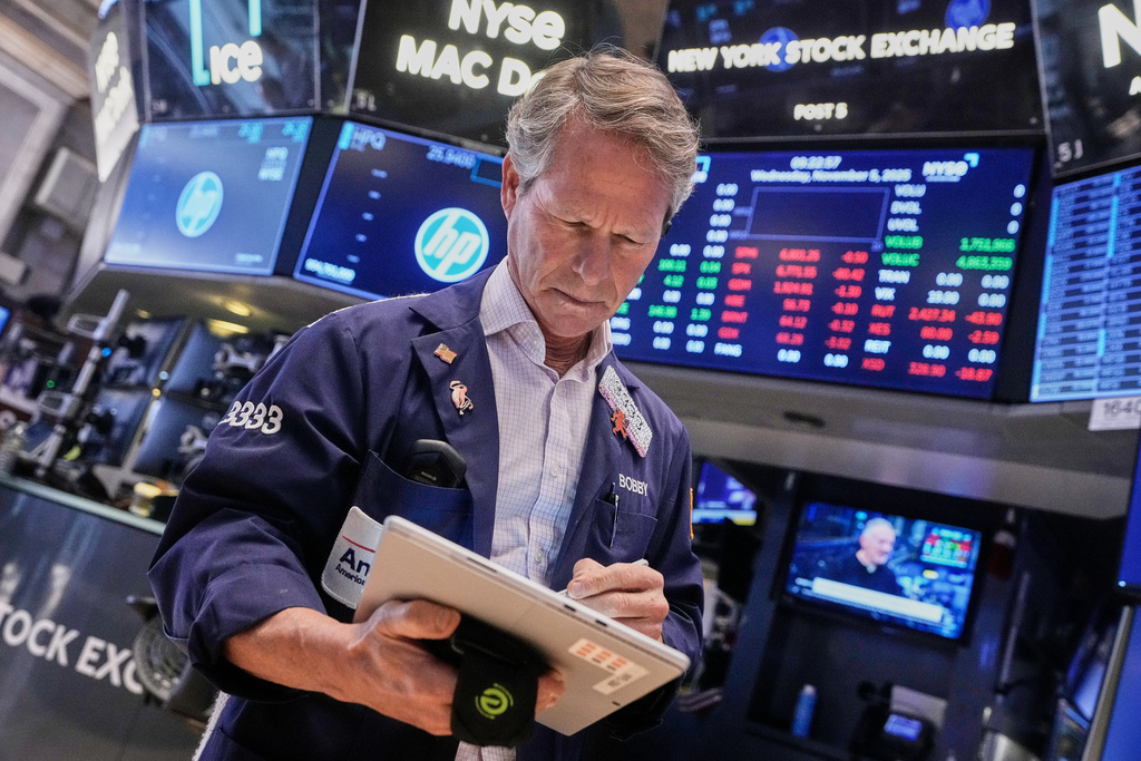 Trader Robert Charmak works on the floor of the New York Stock Exchange, Wednesday, Nov. 5, 2025. (AP Photo/Richard Drew)