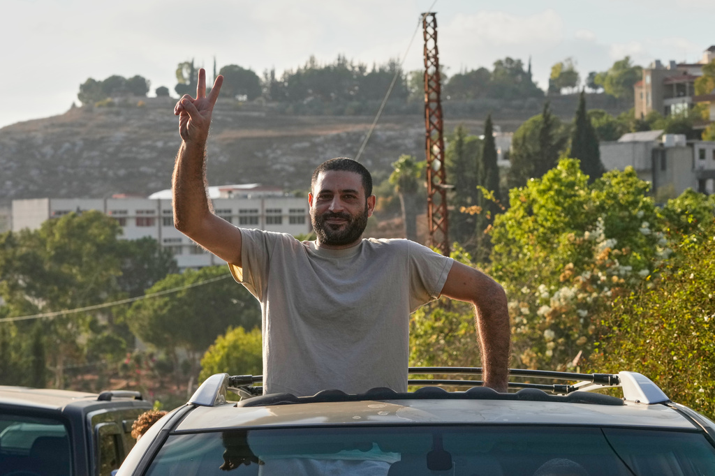 Hussein Ayash, who was released from an Israeli prison, flashes the victory sign as he arrives at his family home in the southern village of Harouf, Lebanon, Friday, Sept. 4, 2026. (AP Photo/Mohammed Zaatari)