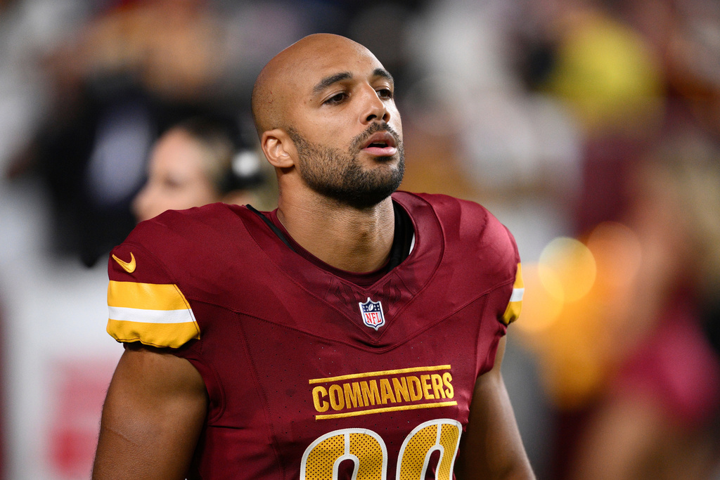 FILE - Washington Commanders running back Austin Ekeler (30) looks on before an NFL preseason football game against the Cincinnati Bengals, Monday, Aug. 18, 2025, in Landover, Md. (AP Photo/Nick Wass, file)
