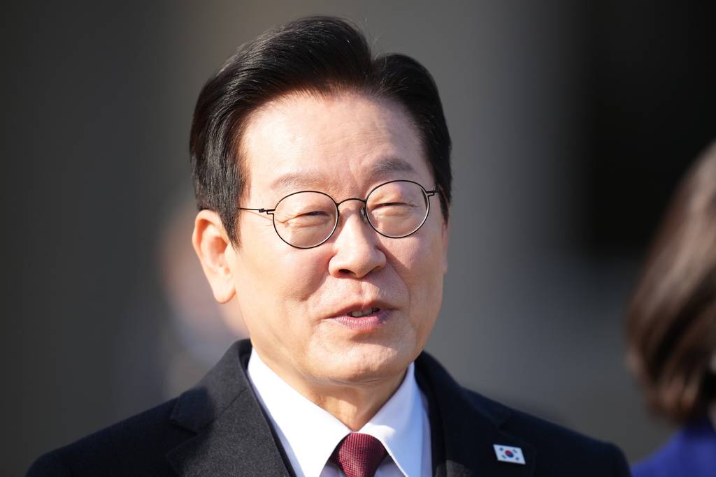 South Korean President Lee Jae Myung arrives to depart for China at the Seoul airport in Seongnam, South Korea, Sunday, Jan. 4, 2026. (AP Photo/Lee Jin-man)