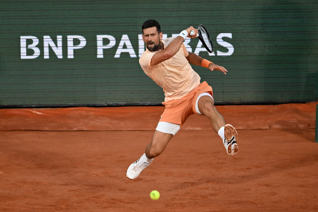 Novak Djokovic of Serbia returns to Giovanni Mpetshi Perricard of France during their first round men's singles tennis match at the French Open tennis tournament in Paris, Sunday, May 24, 2026. (AP Photo/Emma Da Silva)