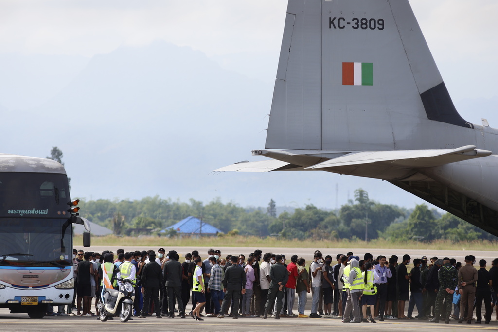India nationals, believed to have worked at scam center in Myanmar, board a plane at Thailand's Mae Sot International Airport in Tak, before being sent back to India Thursday, Nov. 6, 2025. (AP Photo/Sarot Meksophawannakul)