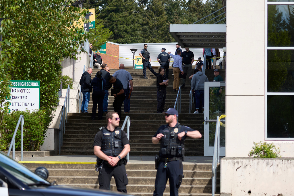 Tacoma Police officers investigate after multiple people were injured in a stabbing at Foss High School, Thursday, April 30, 2026, in Tacoma, Wash. (AP Photo/John Froschauer)