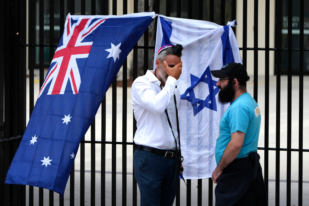 Alex Ryvchin, left, Co-Chief of the Executive Council of Australian Jewry, reacts outside Bondi Pavilion at Sydney's Bondi Beach, Monday, Dec. 15, 2025, a day after a shooting. (AP Photo/Mark Baker)