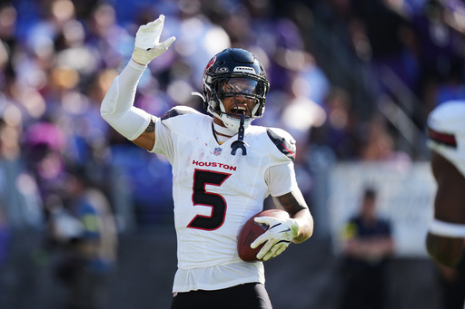 Houston Texans safety Jalen Pitre celebrates after an interception during the second half of an NFL football game against the Baltimore Ravens, Sunday, Oct. 5, 2025, in Baltimore. (AP Photo/Stephanie Scarbrough) Houston Texans safety Jalen Pitre celebrates after an interception during the second half of an NFL football game against the Baltimore Ravens, Sunday, Oct. 5, 2025, in Baltimore. (AP Photo/Stephanie Scarbrough)