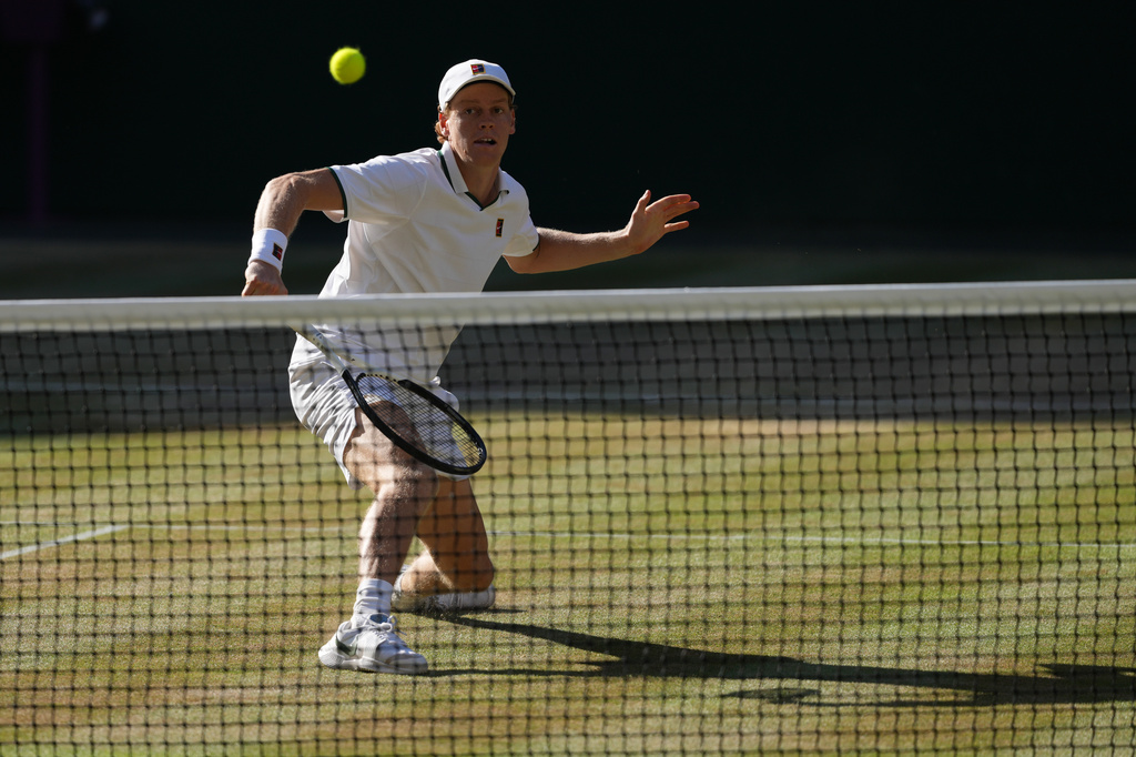 Jannik Sinner of Italy returns the ball to Alexander Zverev of Germany in the men's singles final at Wimbledon Tennis Championships in London, Sunday, July 12, 2026. (AP Photo/Kirsty Wigglesworth)