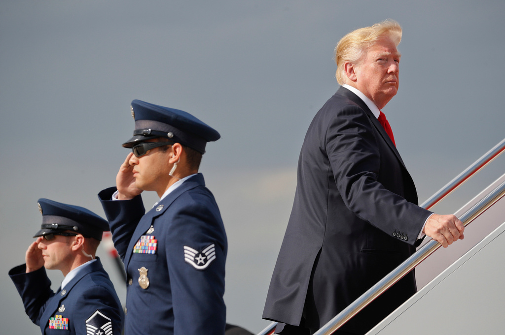 FILE - President Donald Trump boards Air Force One during his departure from Andrews Air Force One Base, Md., April 28, 2018. Trump traveled to Michigan to speak at a rally on the same night as the White House Correspondent's Dinner, the second straight year Trump as skipped the event with the White House Press Corps. (AP Photo/Pablo Martinez Monsivais, File)