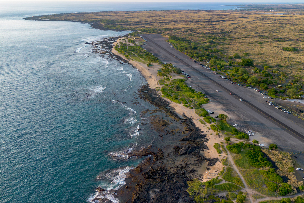 A drone photo shows the shoreline near the Old Kona Airport area, where local groups manage colonies of stray cats, Tuesday, Dec. 2, 2025, in Kailua-Kona, Hawaii. (AP Photo/Mengshin Lin)