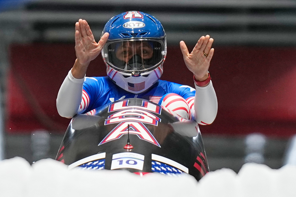 United States' gold medalist Elana Meyers Taylor celebrates at the finish after the women's monobob competition at the 2026 Winter Olympics, in Cortina d'Ampezzo, Italy, Monday, Feb. 16, 2026.(AP Photo/Aijaz Rahi)