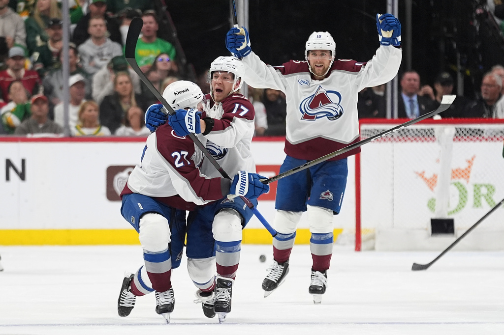 Colorado Avalanche center Parker Kelly, center, celebrates after scoring during the third period of Game 4 in a second-round NHL hockey Stanley Cup playoff series against the Minnesota Wild, Monday, May 11, 2026, in St. Paul, Minn. (AP Photo/Abbie Parr)