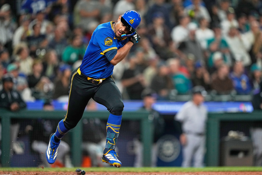 Seattle Mariners' Julio Rodriguez reacts after grounding out during the fourth inning of a baseball game against the Colorado Rockies, Thursday, Sept. 25, 2025, in Seattle. (AP Photo/Ryan Sun)