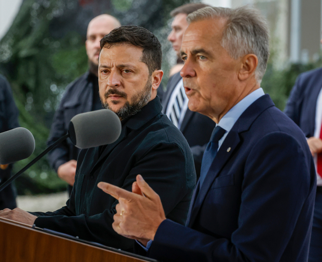 Canadian Prime Minister Mark Carney, right, and Ukraine's President Volodymyr Zelenskyy, speak after signing agreements in Calgary, Alberta, Canada, Thursday, Sept. 10, 2026. (Jeff McIntosh/The Canadian Press via AP)