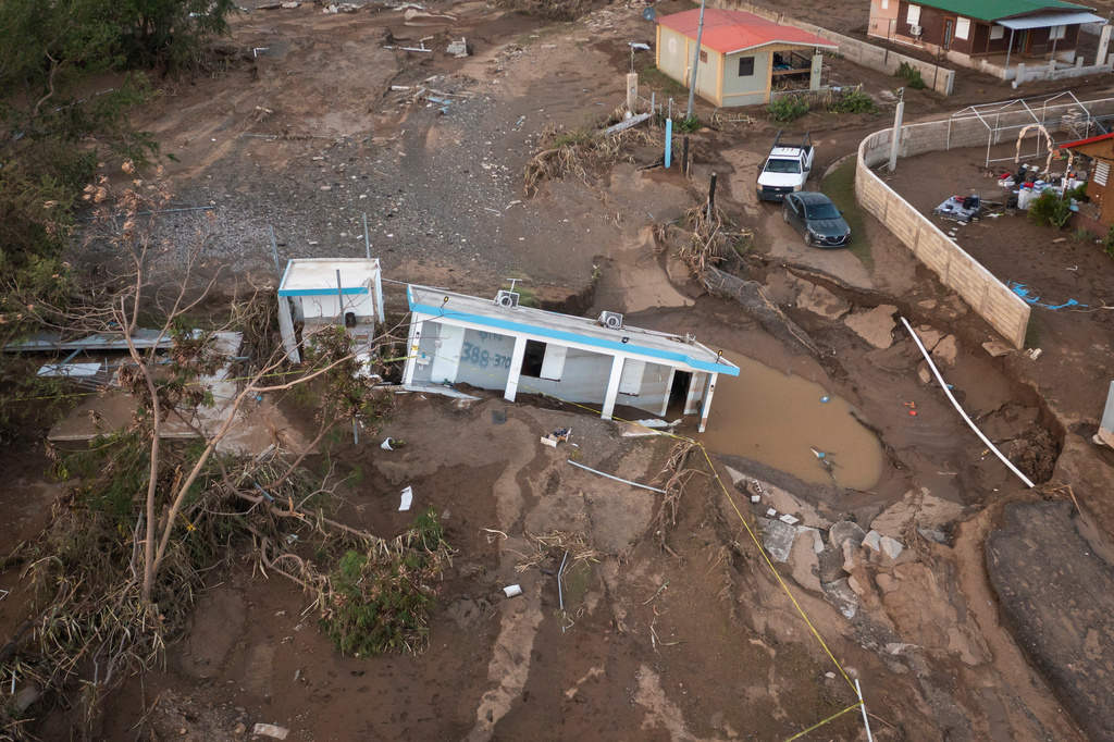 FILE - A house lays in the mud after it was washed away by Hurricane Fiona at Villa Esperanza in Salinas, Puerto Rico, Sept. 21, 2022. (AP Photo/Alejandro Granadillo)