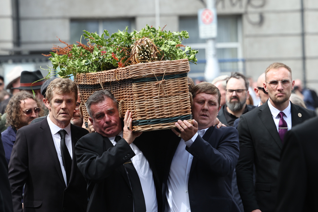 The coffin of Glen Hansard is carried into St Patrick's Cathedral for his funeral service, in Dublin, Tuesday, Aug. 4, 2026. (Damien Eagers/PA via AP)