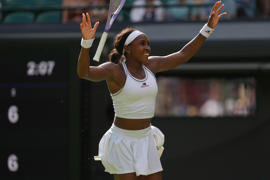 Coco Gauff of the United States drops her racket as she celebrates her victory against Solana Sierra of Argentina in their second round women's singles match at the Wimbledon Tennis Championships in London, Wednesday, July 1, 2026. (AP Photo/Kin Cheung)