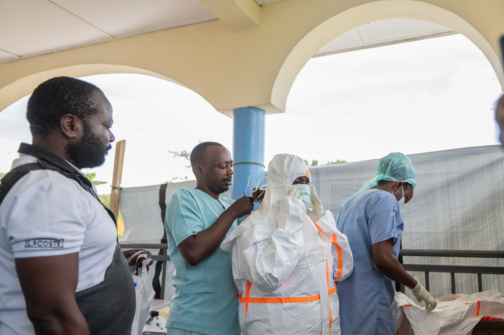 Health workers get ready to start their shift at the Ebola treatment center in Rwampara, Congo, Friday, May 29, 2026. (AP Photo/Moses Sawasawa)