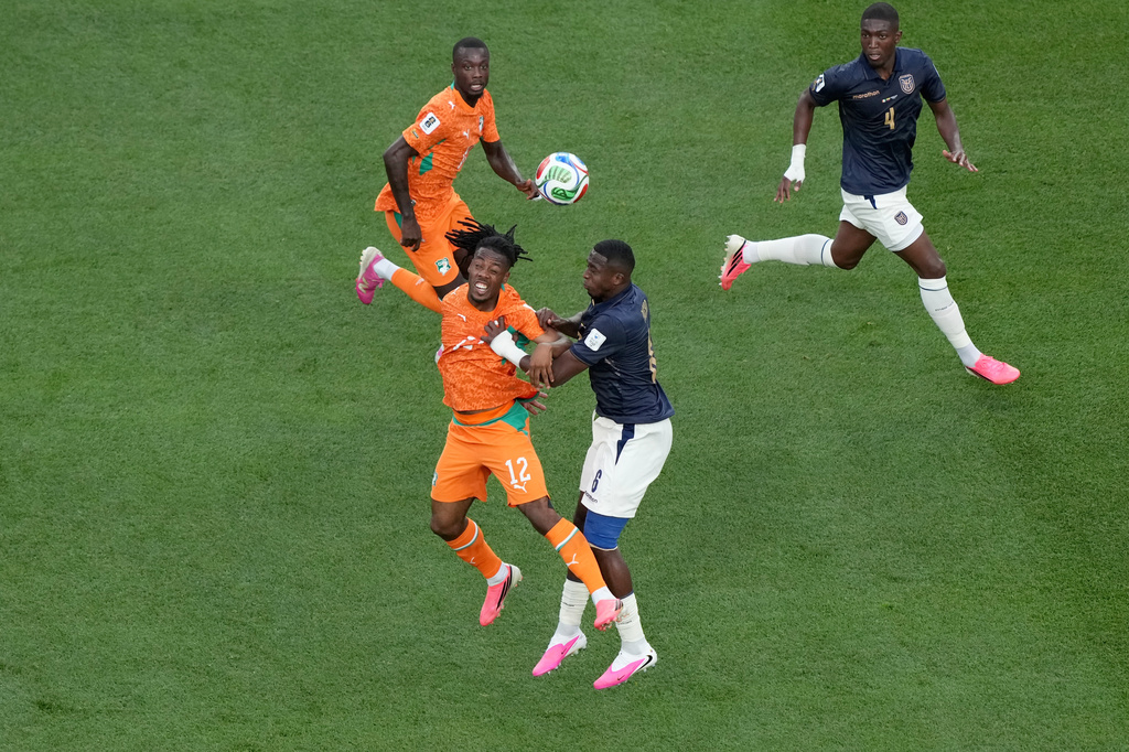 Ivory Coast's Elye Wahi (12) and Ecuador's Willian Pacho (6) jump to head the ball during the World Cup Group E soccer match between Ivory Coast and Ecuador in Philadelphia, Sunday, June 14, 2026. (AP Photo/Matt Rourke)